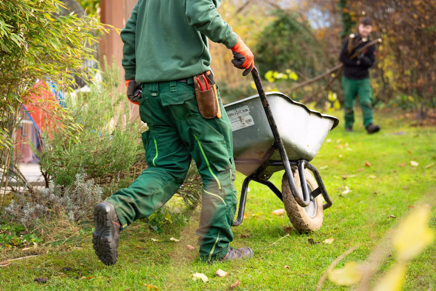 Greenline landscaper maintaining a mature garden